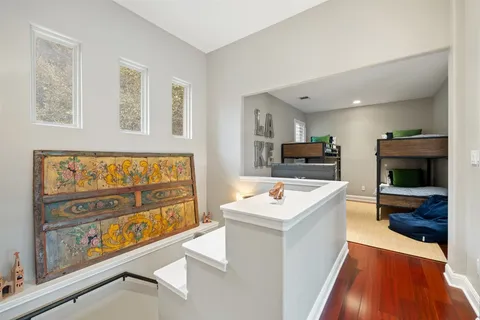 a bedroom with a bed and a tv on table