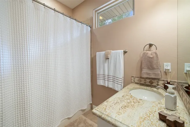 a view of a lake with houses in the background