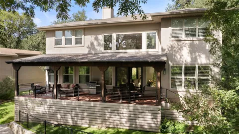 a view of a patio with a table chairs and a backyard