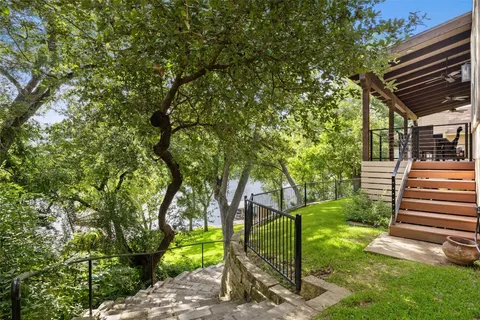 a view of a yard with a tree