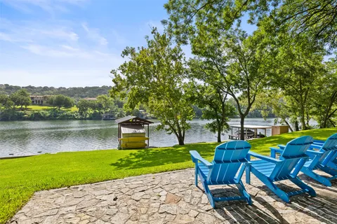 a view of a lake with houses in the background