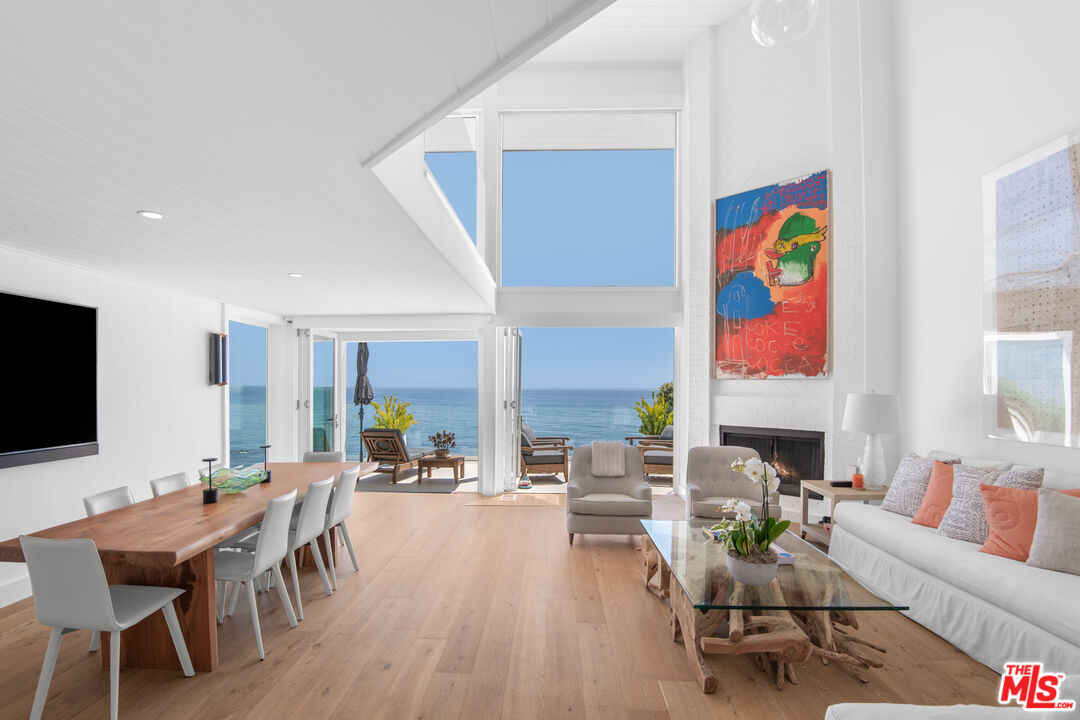 a living room with fireplace furniture and a flat screen tv