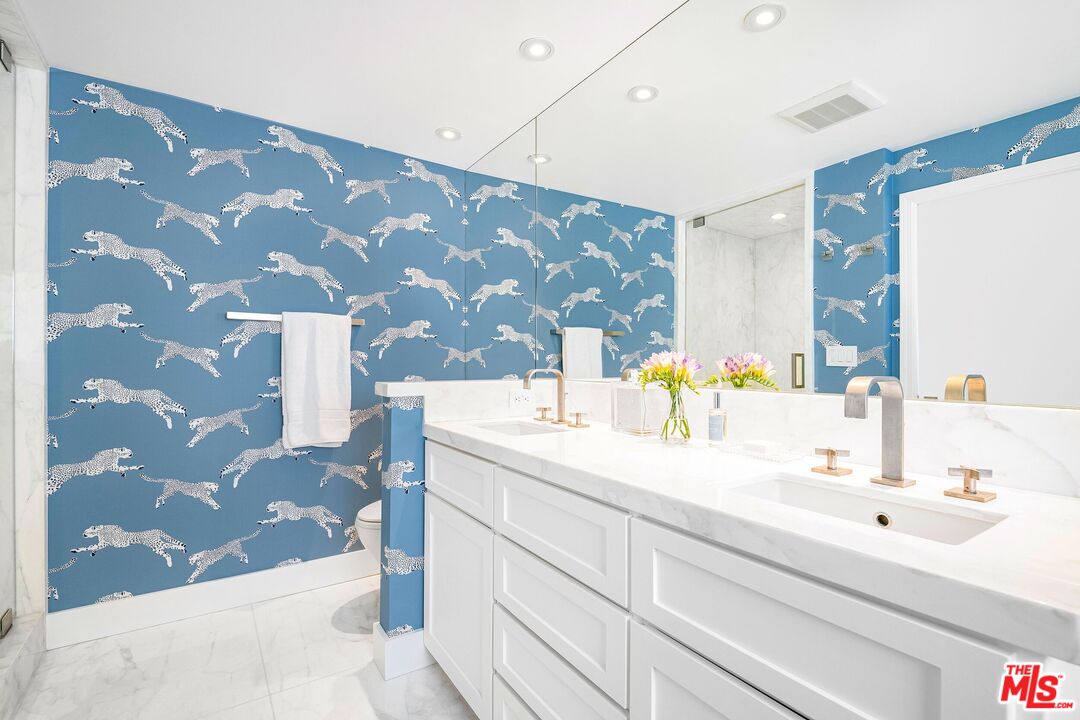 24134 Malibu Road Malibu, CA 90265 - Photo 18 of 39 a bathroom with a sink and a mirror