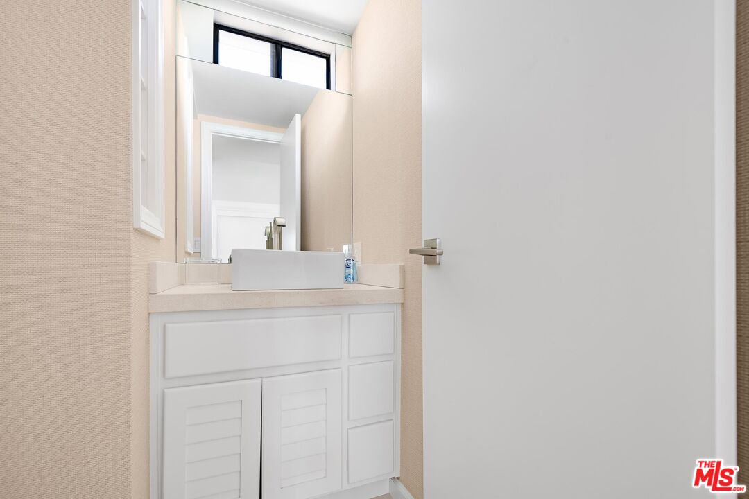 24134 Malibu Road Malibu, CA 90265 - Photo 26 of 39 a bathroom with a sink and a mirror