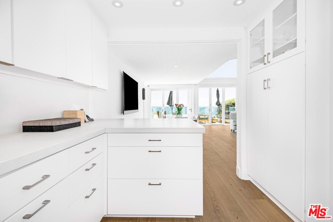 24134 Malibu Road Malibu, CA 90265 - Photo 10 of 39 a bathroom with a sink and a mirror