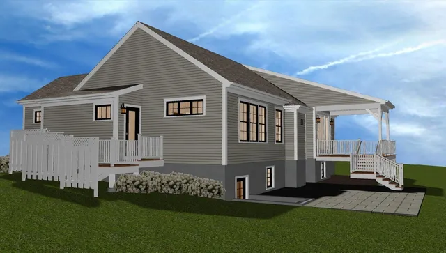 a front view of a house with a garden