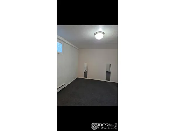 a view of a living room with a black white and white wall