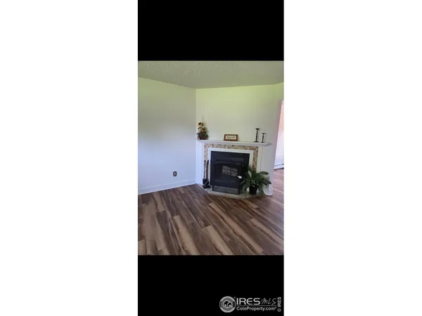 a view of living room with furniture and a flat screen