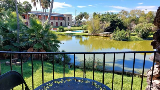a view of swimming pool from a balcony