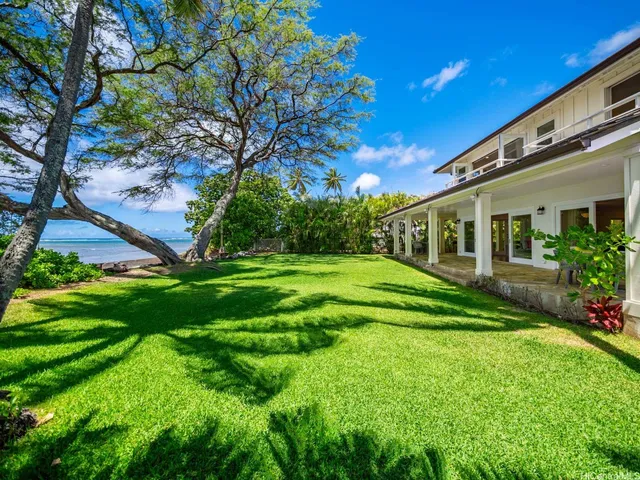 a view of a house with a big yard