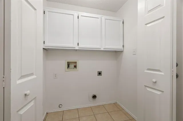 a view of a livingroom with an empty space and a window