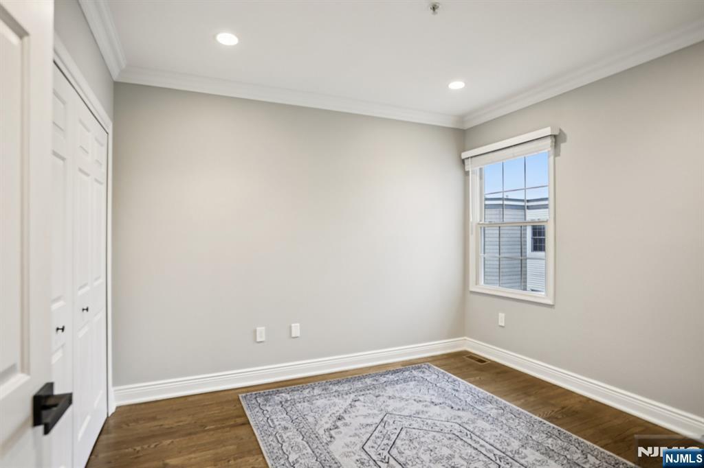 343 The Promenade, Unit 343 Edgewater, NJ 07020 - Photo 16 of 38 a view of an empty room with a window