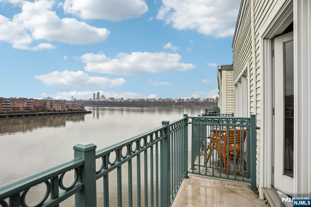 343 The Promenade, Unit 343 Edgewater, NJ 07020 - Photo 27 of 38 a balcony with city view