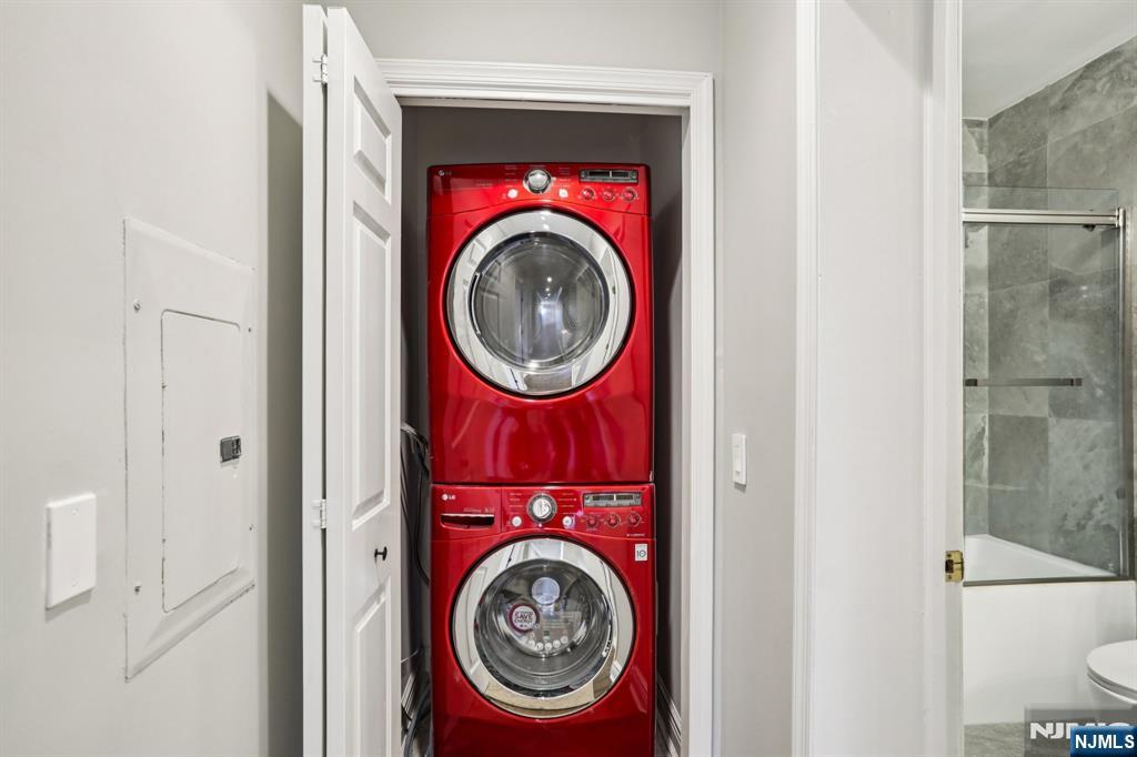 343 The Promenade, Unit 343 Edgewater, NJ 07020 - Photo 28 of 38 a utility room with dryer and washer