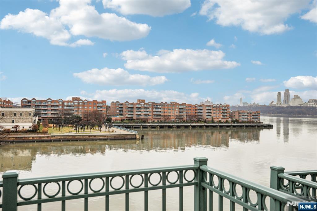 343 The Promenade, Unit 343 Edgewater, NJ 07020 - Photo 30 of 38 a view of a lake with a city