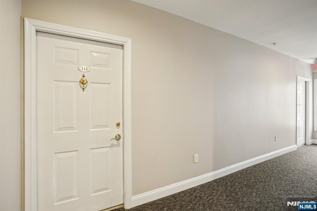 343 The Promenade, Unit 343 Edgewater, NJ 07020 - Photo 34 of 38 an empty room with closet