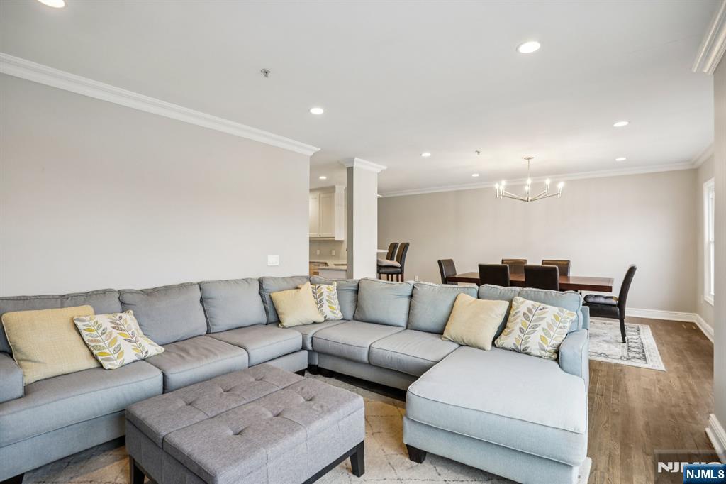 343 The Promenade, Unit 343 Edgewater, NJ 07020 - Photo 4 of 38 a living room with furniture and a couch