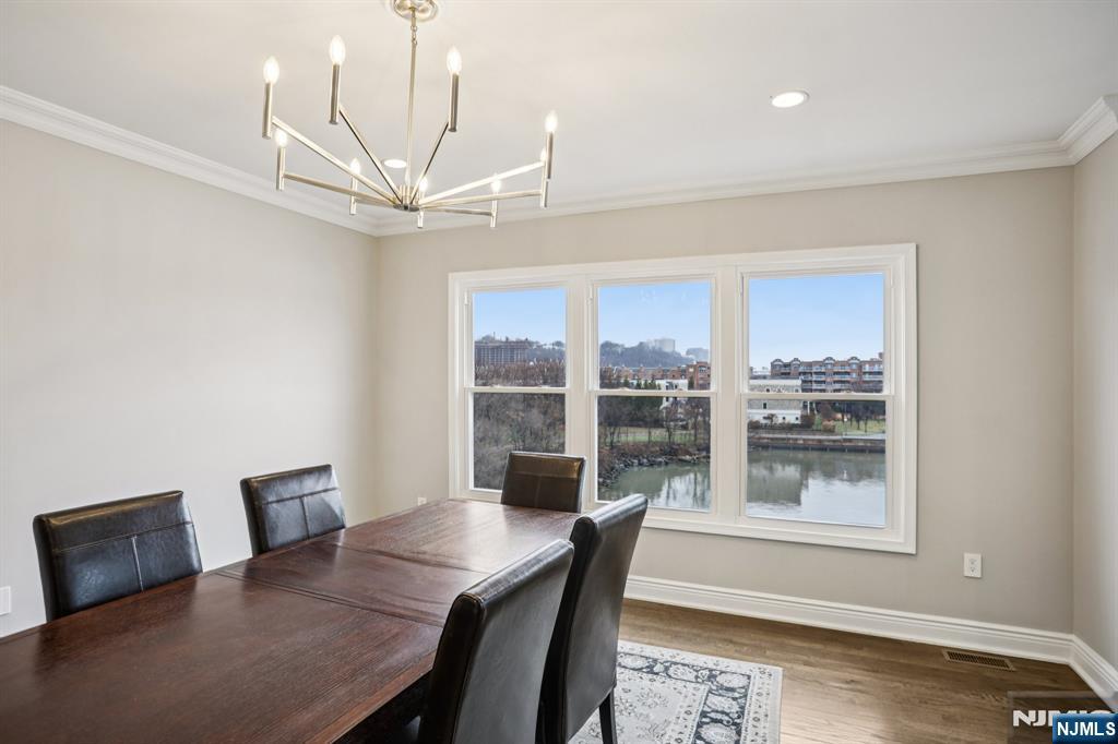 343 The Promenade, Unit 343 Edgewater, NJ 07020 - Photo 7 of 38 a workspace with furniture and a window