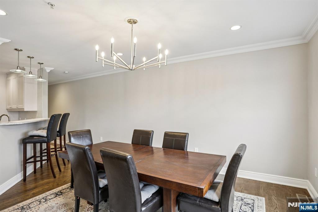 343 The Promenade, Unit 343 Edgewater, NJ 07020 - Photo 9 of 38 a view of a dining room with furniture