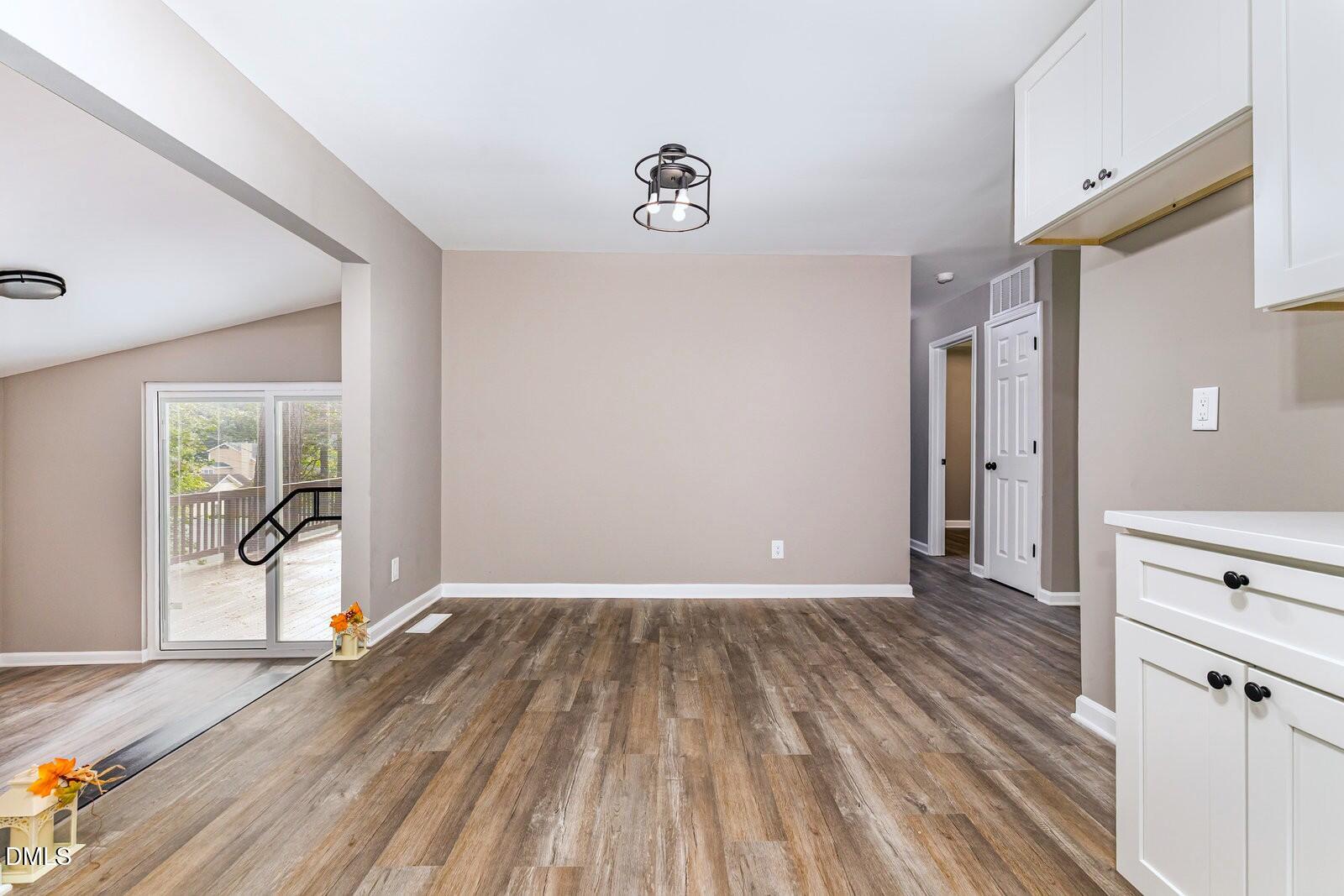 3204 Friar Tuck Road Raleigh, NC 27610 - Photo 10 of 26 a view of empty room with wooden floor