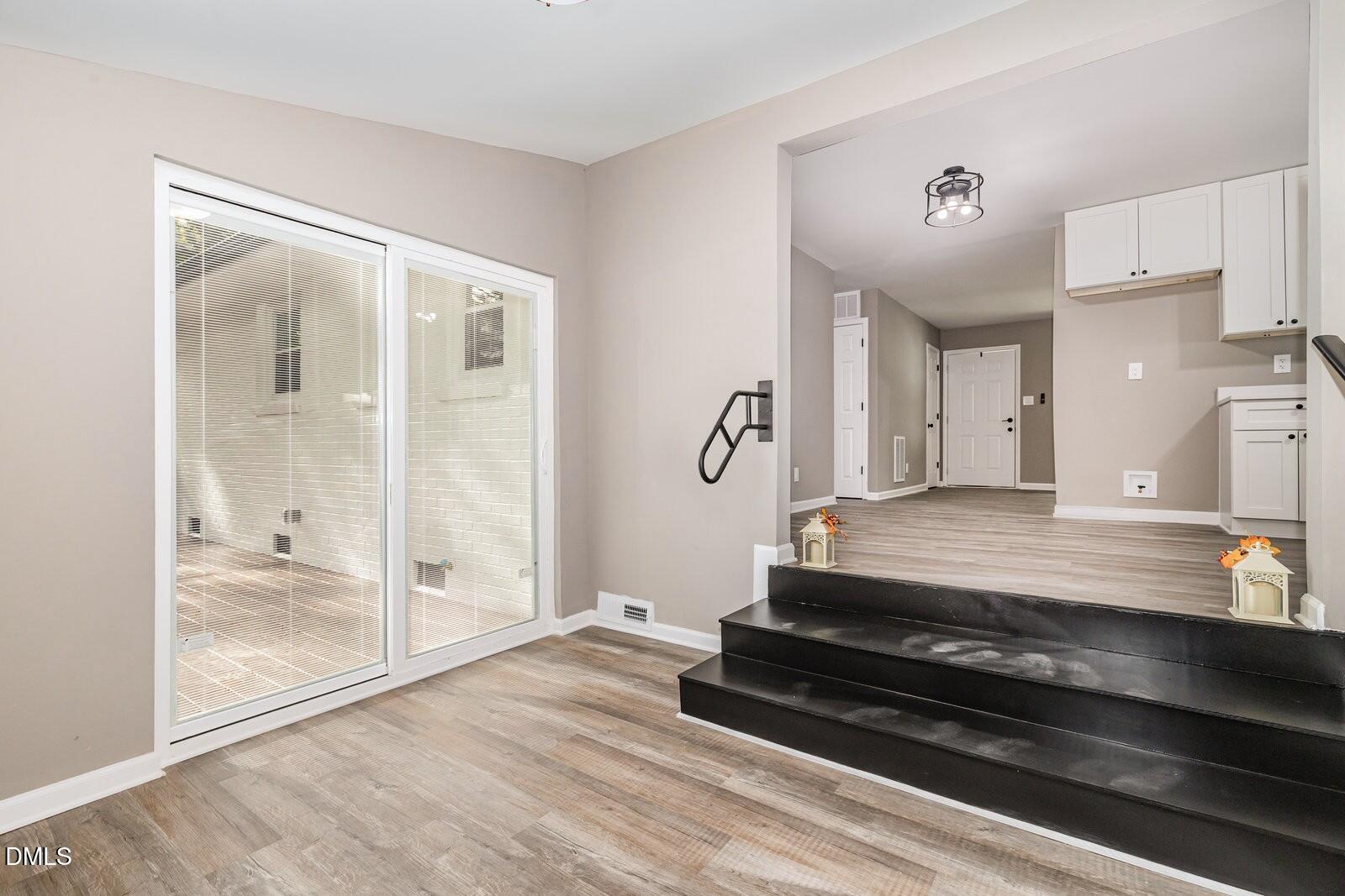 3204 Friar Tuck Road Raleigh, NC 27610 - Photo 11 of 26 a spacious bathroom with a glass door shower and a mirror