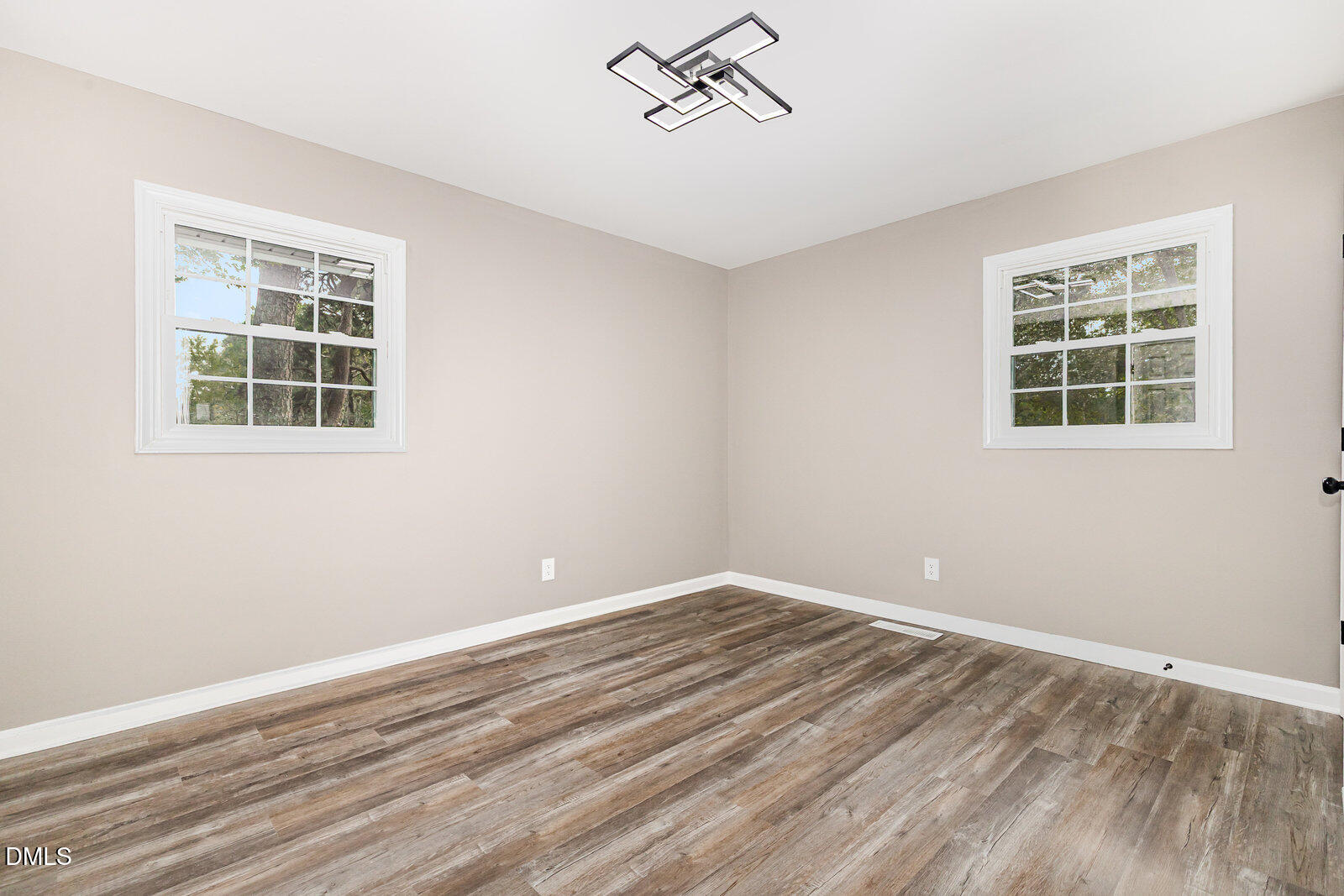 3204 Friar Tuck Road Raleigh, NC 27610 - Photo 14 of 26 a view of empty room with windows