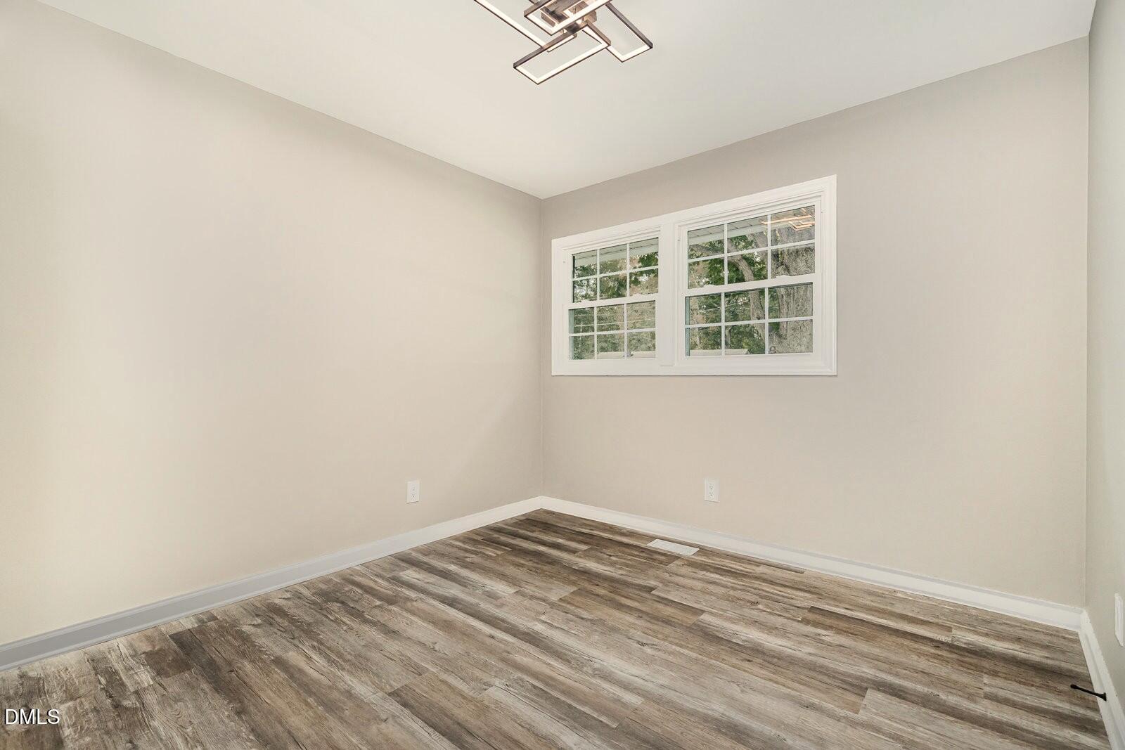 3204 Friar Tuck Road Raleigh, NC 27610 - Photo 16 of 26 an empty room with a window