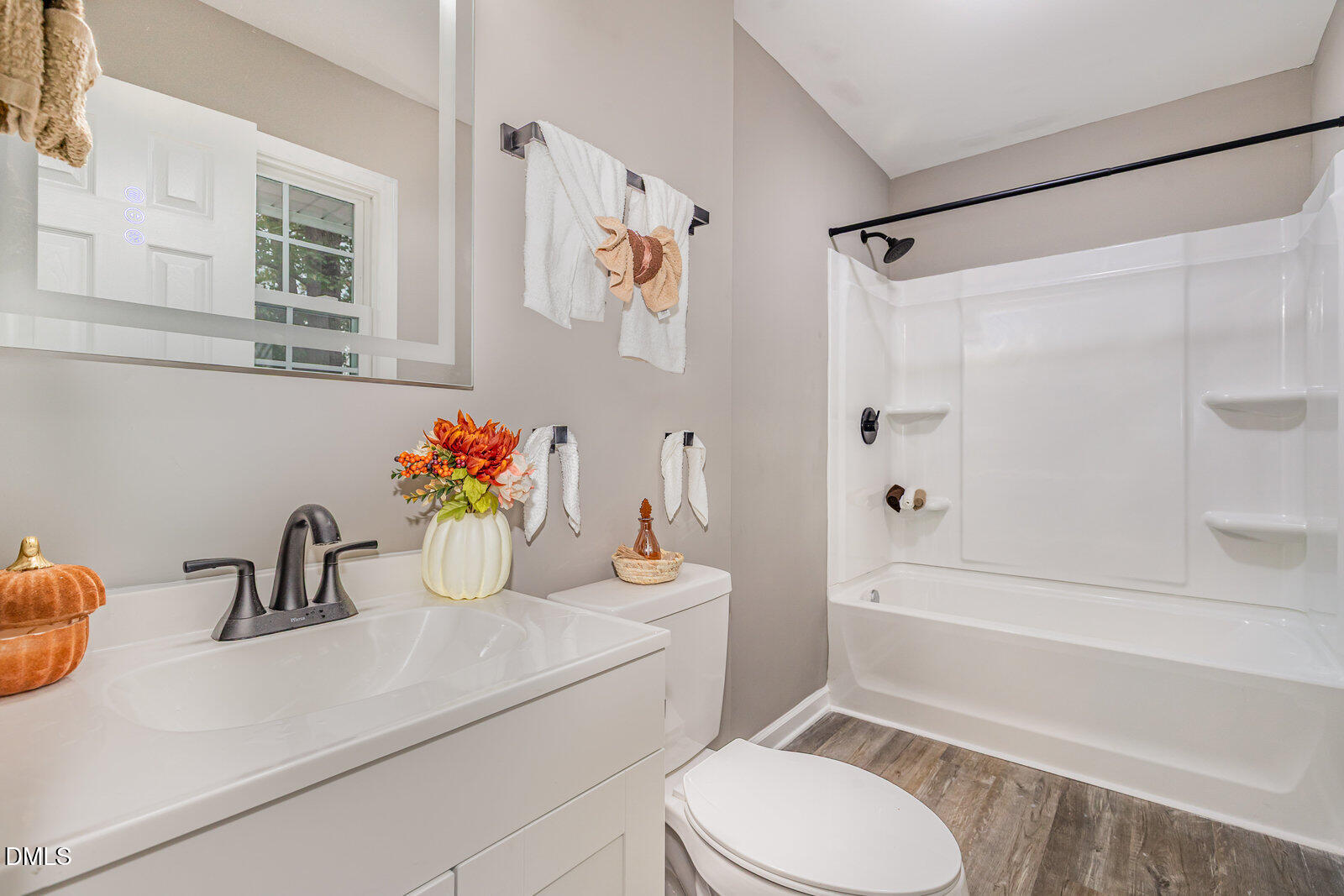 3204 Friar Tuck Road Raleigh, NC 27610 - Photo 19 of 26 a bathroom with a sink a toilet and a bathtub