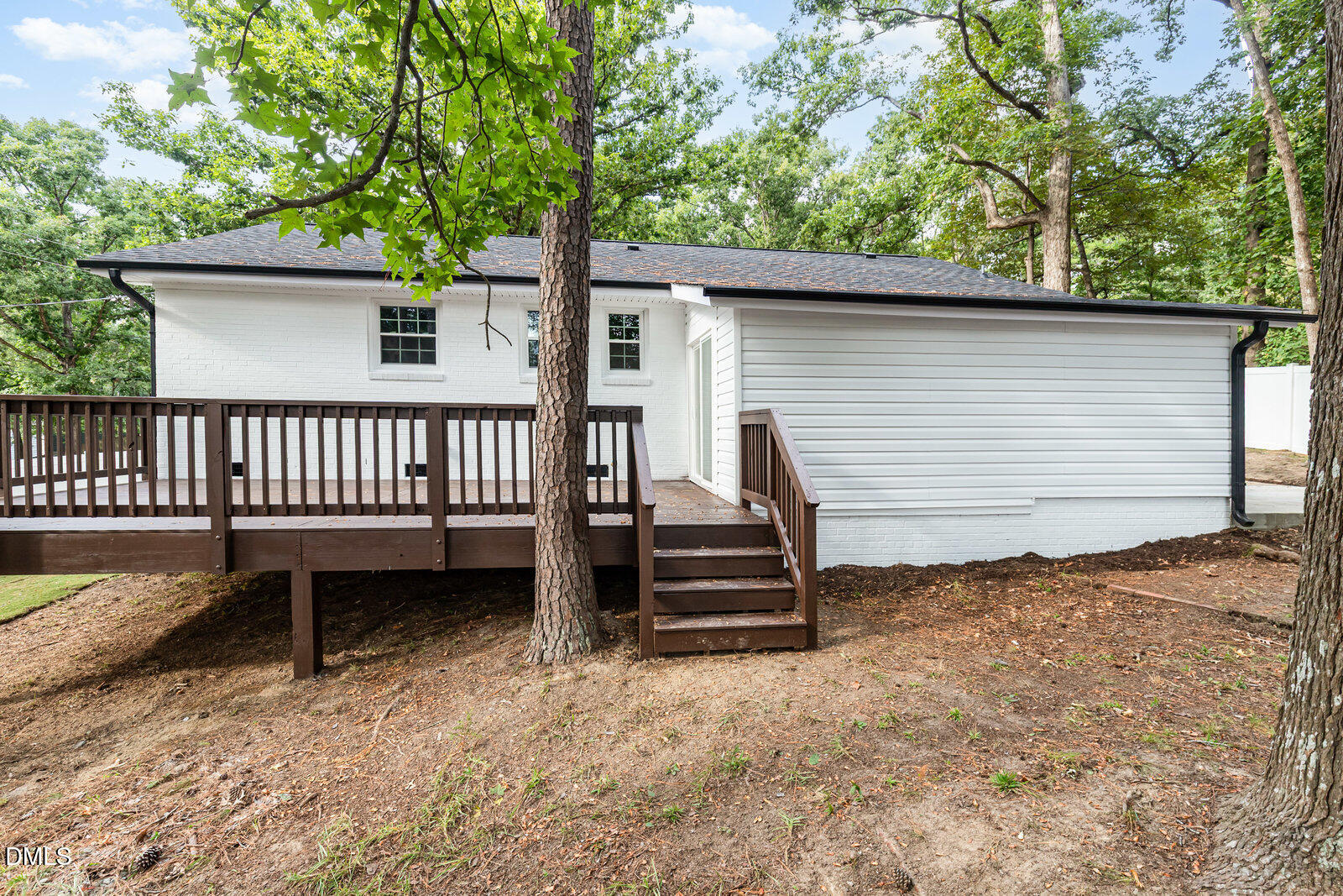 3204 Friar Tuck Road Raleigh, NC 27610 - Photo 22 of 26 a view of a backyard with a small deck