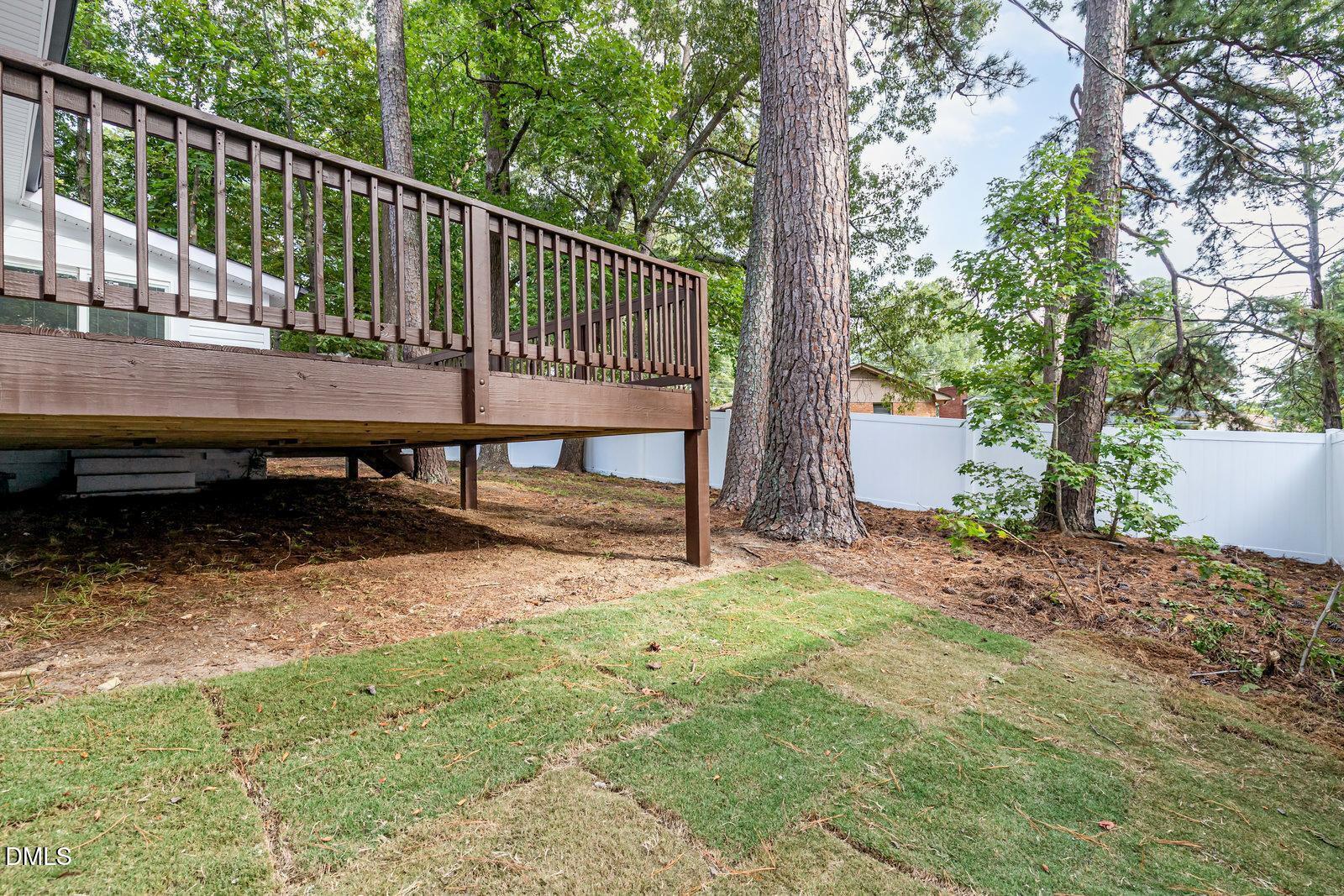 3204 Friar Tuck Road Raleigh, NC 27610 - Photo 24 of 26 a view of a deck with a bench and wooden fence