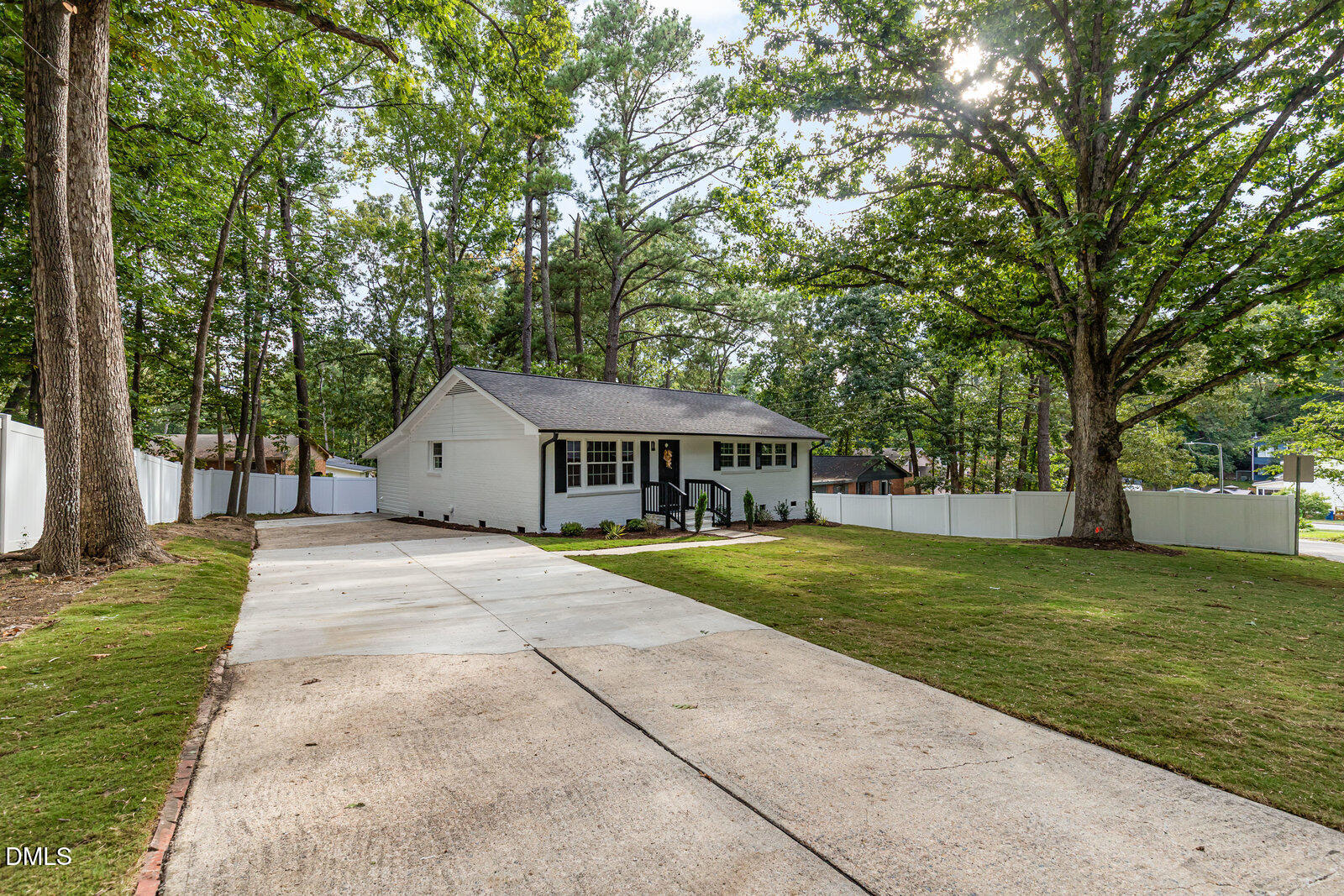 3204 Friar Tuck Road Raleigh, NC 27610 - Photo 2 of 26 a house with trees in front of it