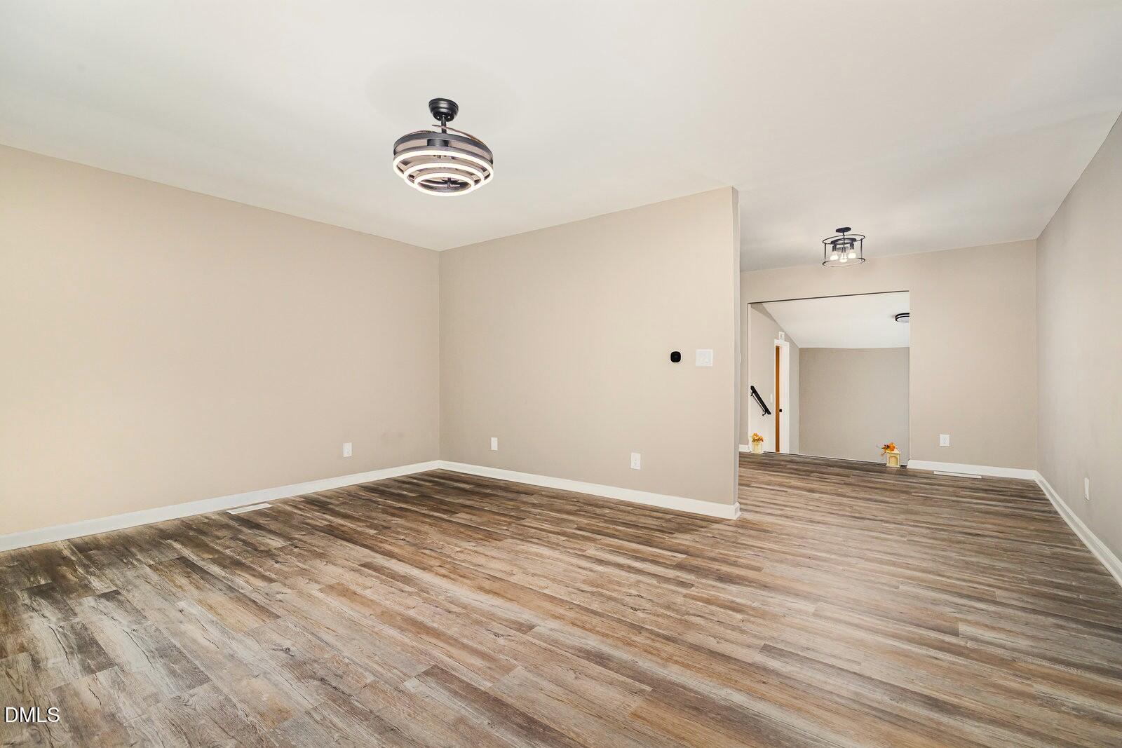 3204 Friar Tuck Road Raleigh, NC 27610 - Photo 4 of 26 a view of a livingroom with wooden floor