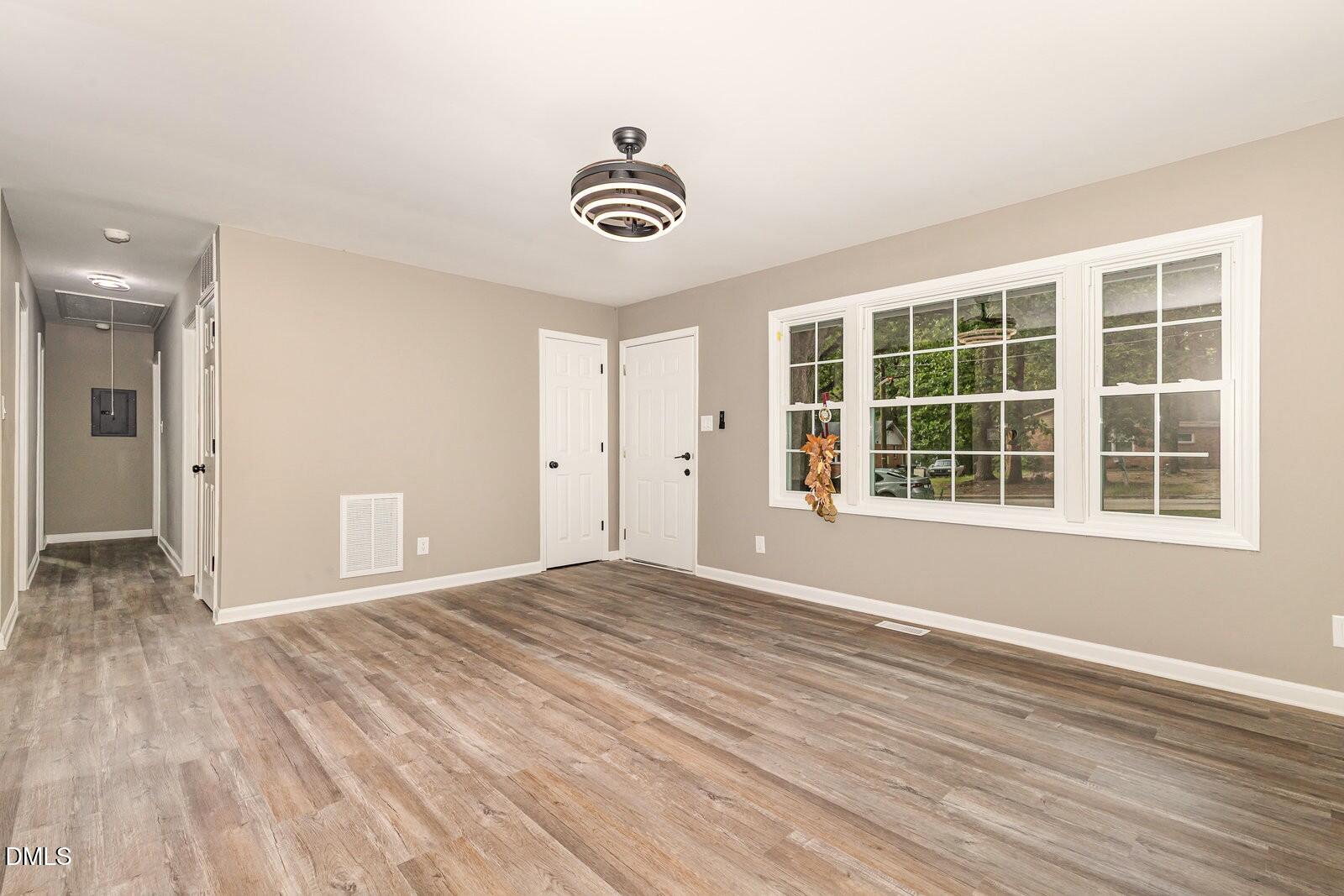 3204 Friar Tuck Road Raleigh, NC 27610 - Photo 7 of 26 a view of empty room with wooden floor