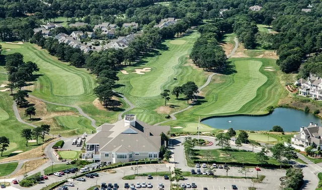 an aerial view of a residential houses with outdoor space