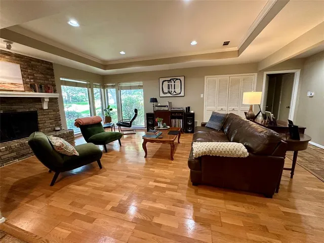 a living room with furniture window and fireplace