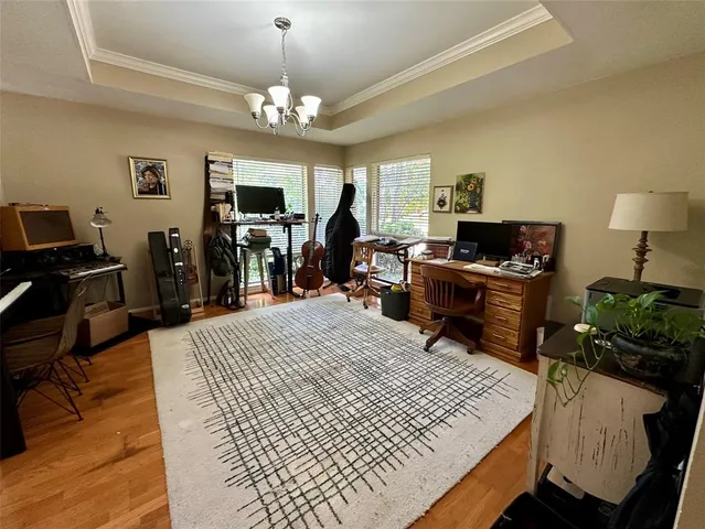 a bed room with a bed and a television