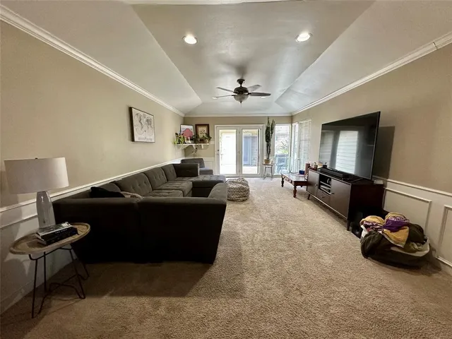 a living room with furniture gym equipment and a window