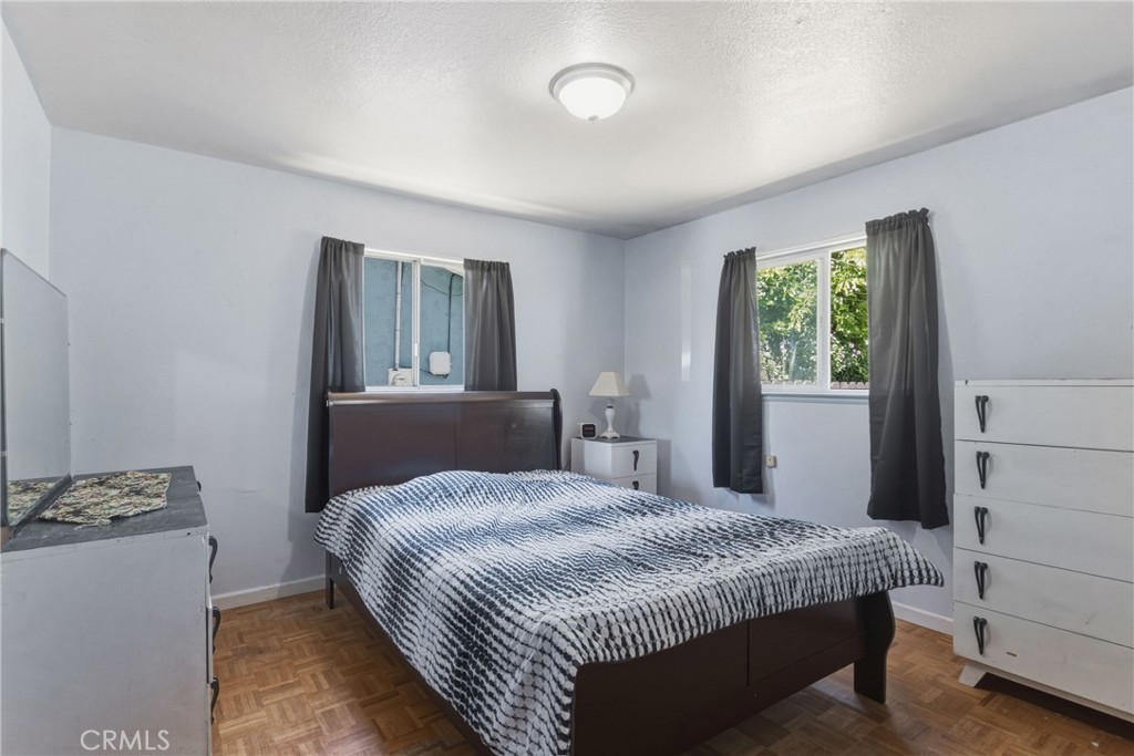 6812 Helton Street Winton, CA 95388 - Photo 10 of 24 a bedroom with a bed and a window