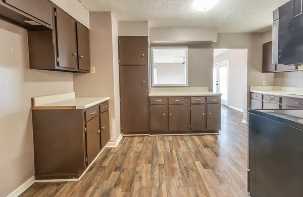 a spacious bathroom with a sink a mirror and bathtub