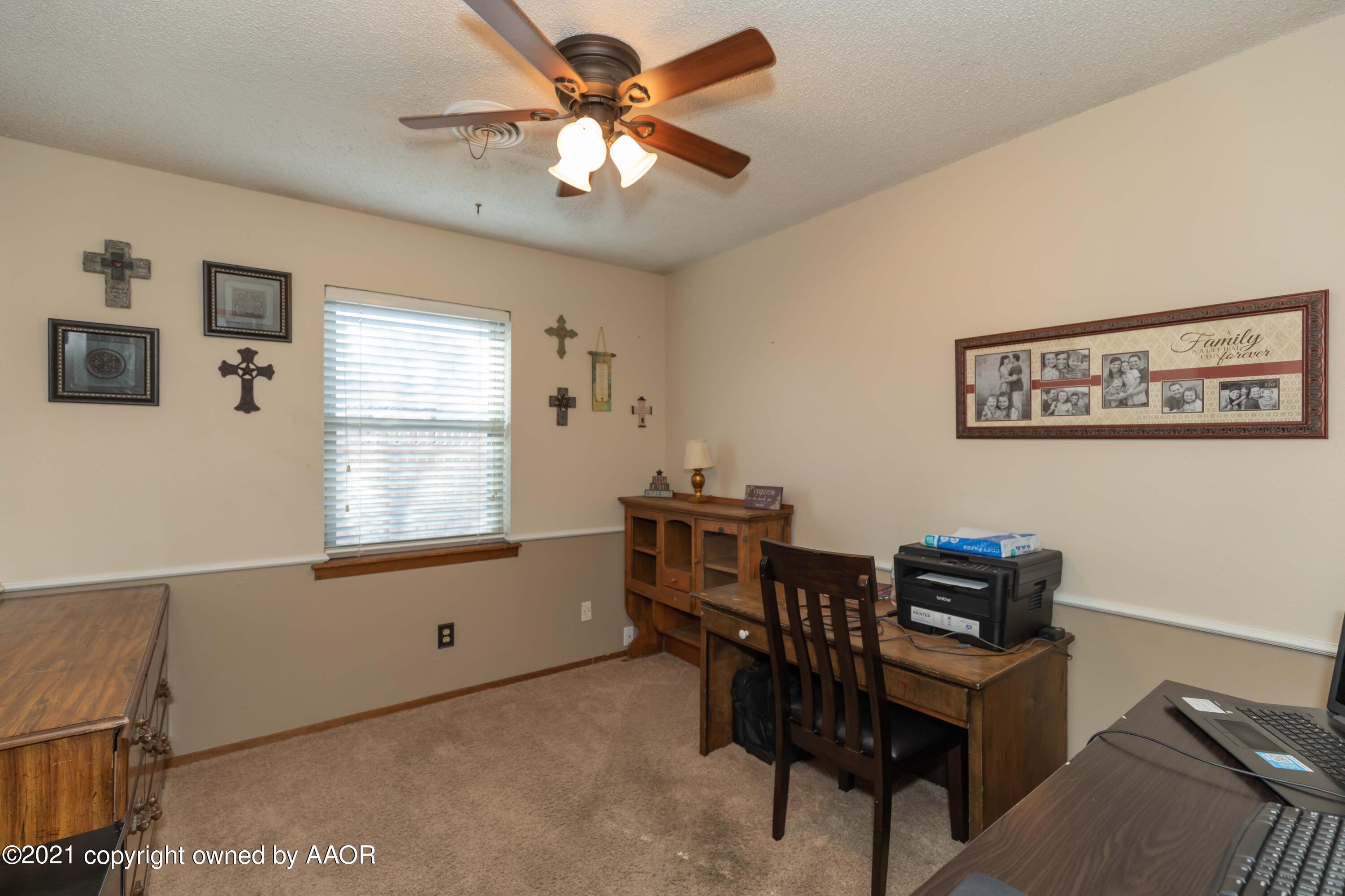 8100 Santa Fe Trail Amarillo, TX 79110 - Photo 22 of 35 a view of a workspace with furniture and a window