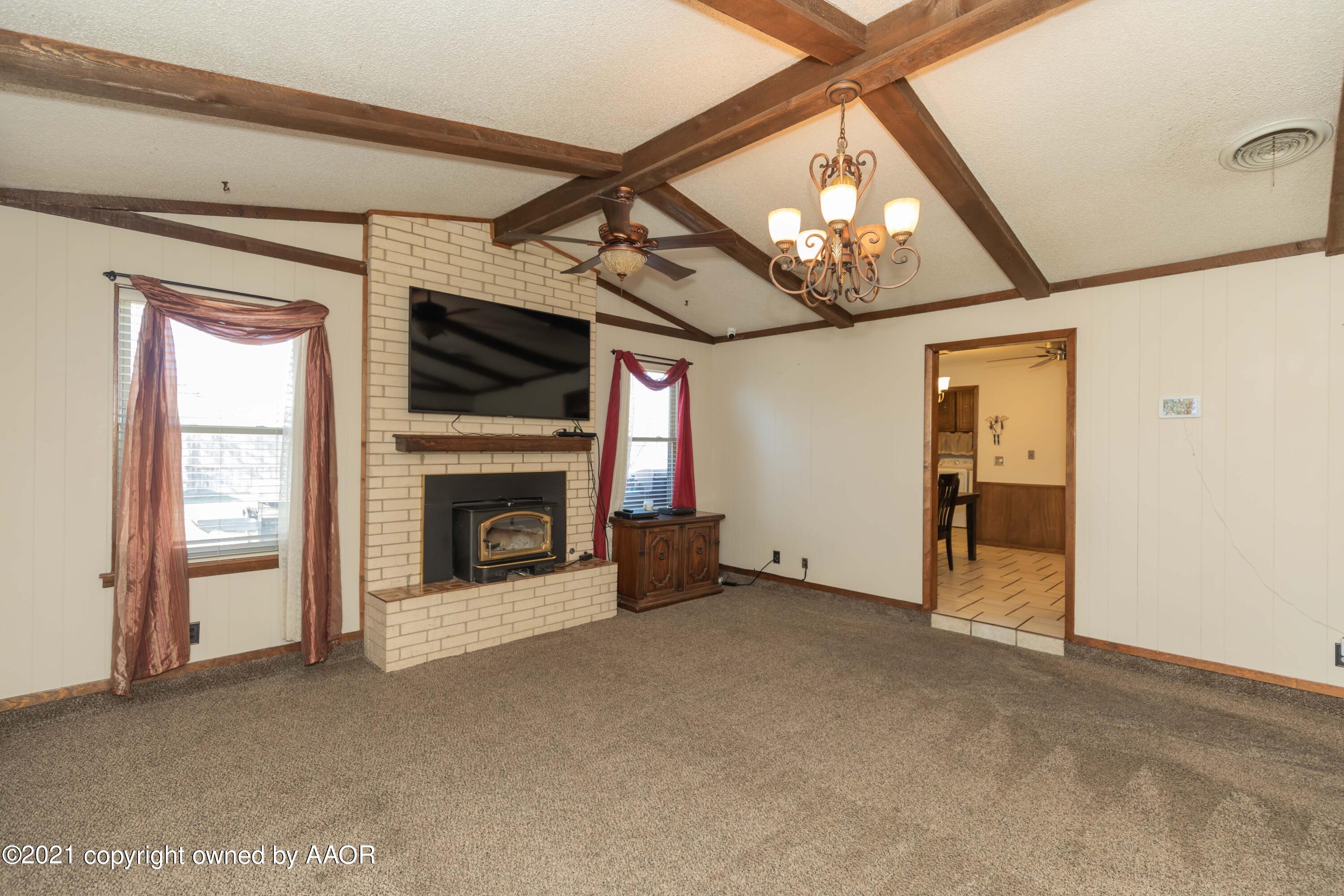 8100 Santa Fe Trail Amarillo, TX 79110 - Photo 7 of 35 a view of a livingroom with an empty space and a fireplace