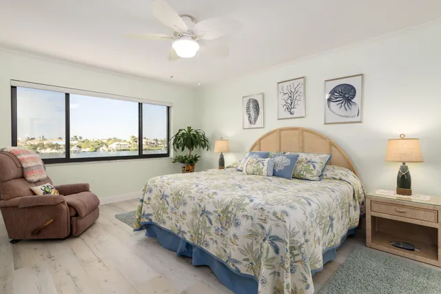 a bedroom with bed and balcony