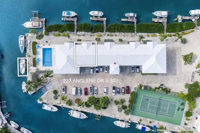 an aerial view of a house with yard swimming pool and outdoor seating