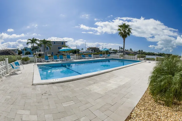a view of a swimming pool with a patio