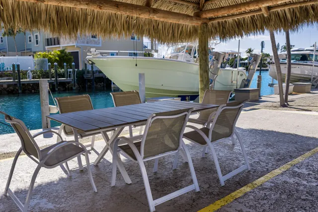 a kitchen with refrigerator a microwave and white cabinets