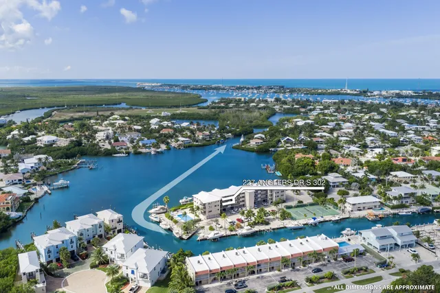 an aerial view of a house with a ocean view