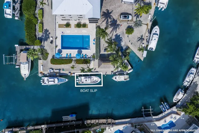 an aerial view of a house with a swimming pool