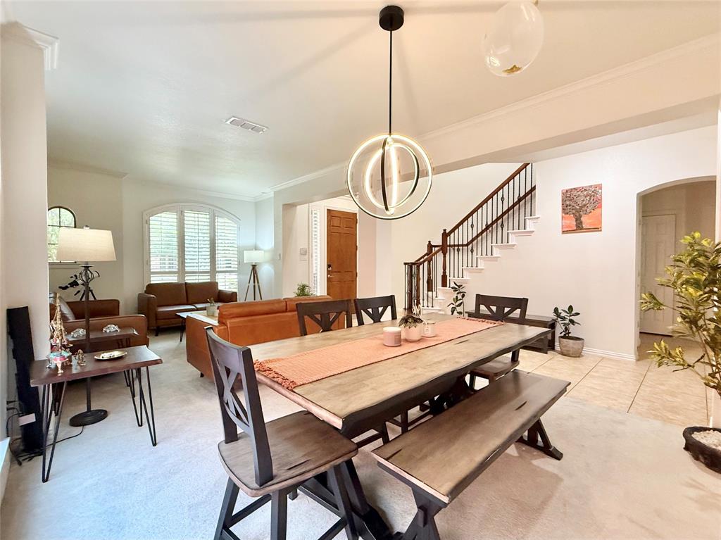2754 Ridge View Road Frisco, TX 75034 - Photo 7 of 34 a view of a dining room and livingroom furniture and a chandelier
