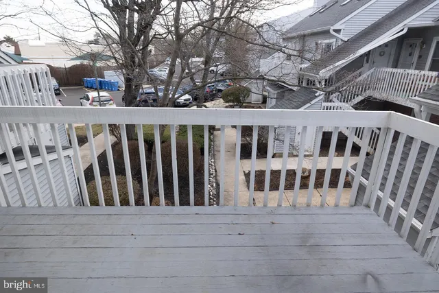 a view of wooden house with a large window