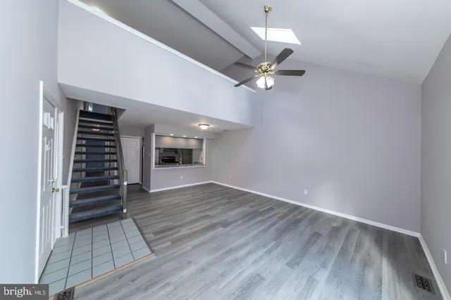 wooden floor in an empty room with a fireplace